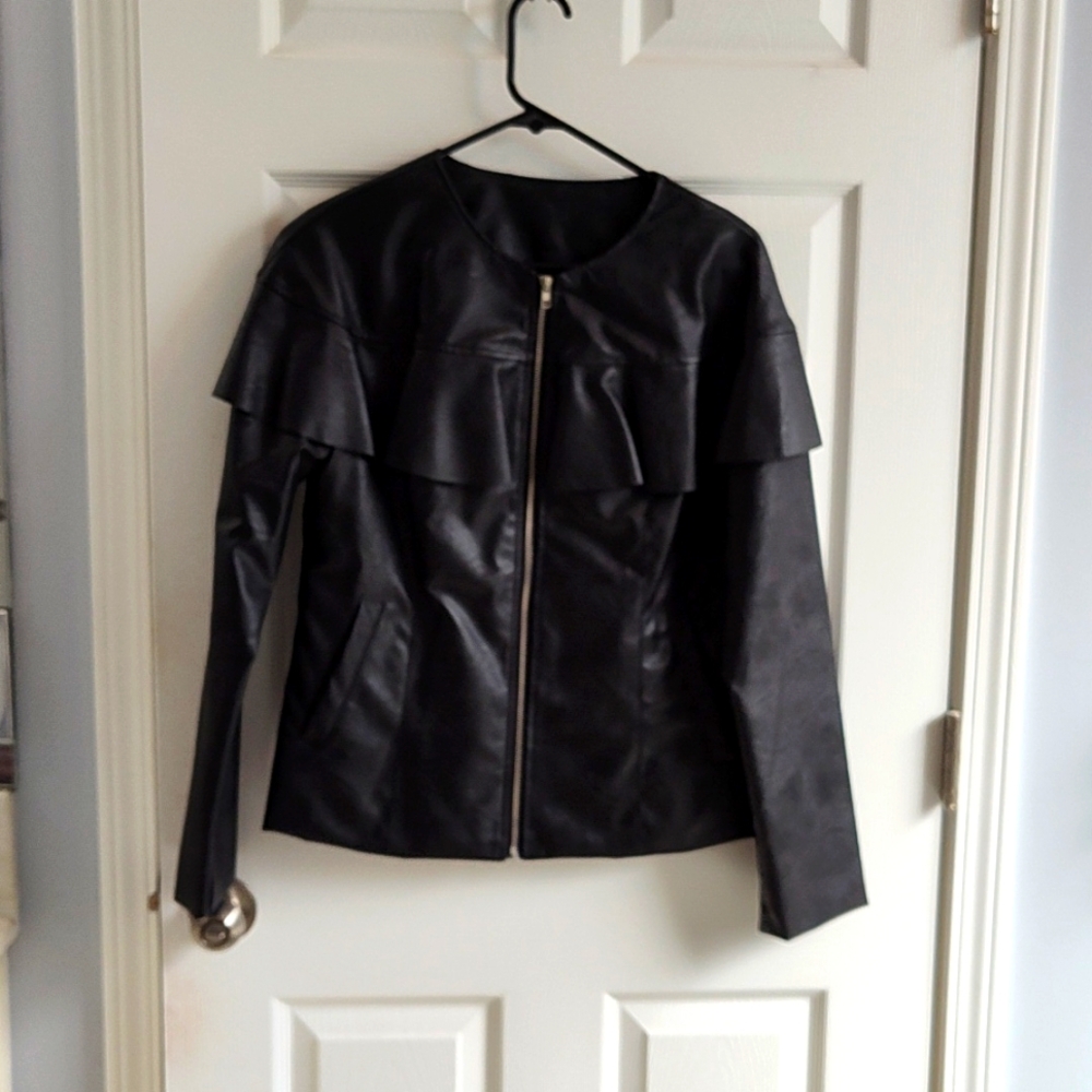 Black looks like leather jacket crop style to waist with long sleeves.